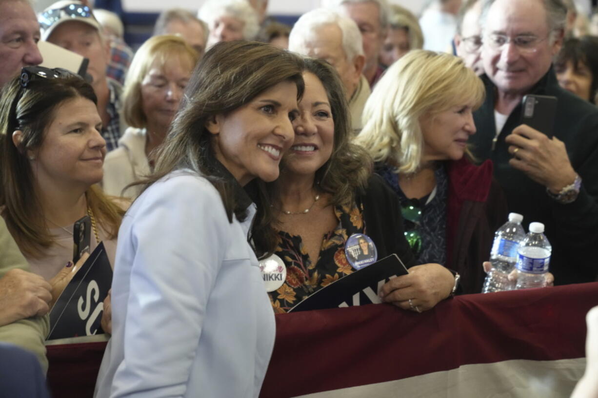 GOP presidential hopeful Nikki Haley takes selfies with supporters after a campaign event on Monday, Nov. 27, 2023, in Bluffton, S.C. Haley is among a cluster of Republican candidates competing for second place in a GOP Republican primary thus far largely dominated by former President Donald Trump.