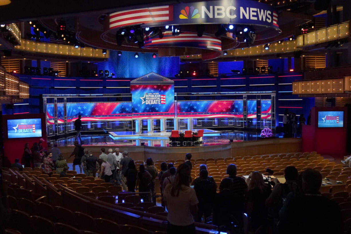 Photographers check out the stage during a walk through, Tuesday, Nov. 7, 2023, for the third Republican presidential debate in Miami. Five hopefuls will participate in the debate at the Adrienne Arsht Center for the Performing Arts of Miami-Dade County, according to the Republican National Committee. They are Florida Gov. Ron DeSantis, businessman Vivek Ramaswamy, former U.N. Ambassador Nikki Haley, Sen. Tim Scott, R-S.C., and former New Jersey Gov. Chris Christie.