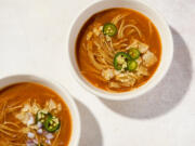 This image released by Milk Street shows a recipe for Mexican noodle soup with fire-roasted tomatoes.