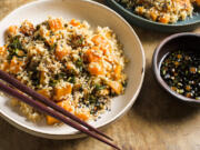 This image released by Milk Street shows a recipe for sweet potato brown rice with soy and scallions.