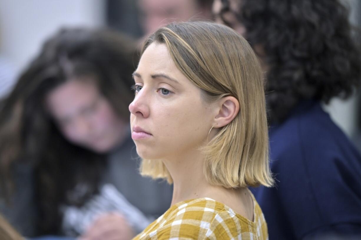 Faith Cerny, a graduate student in city planning at the Massachusetts Institute of Technology, center, listens during a course concerning the conflicts that arise in the siting process of renewable energy projects at MIT on Sept. 15 in Cambridge, Mass.