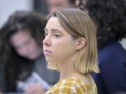 Faith Cerny, a graduate student in city planning at the Massachusetts Institute of Technology, center, listens during a course concerning the conflicts that arise in the siting process of renewable energy projects at MIT on Sept. 15 in Cambridge, Mass.