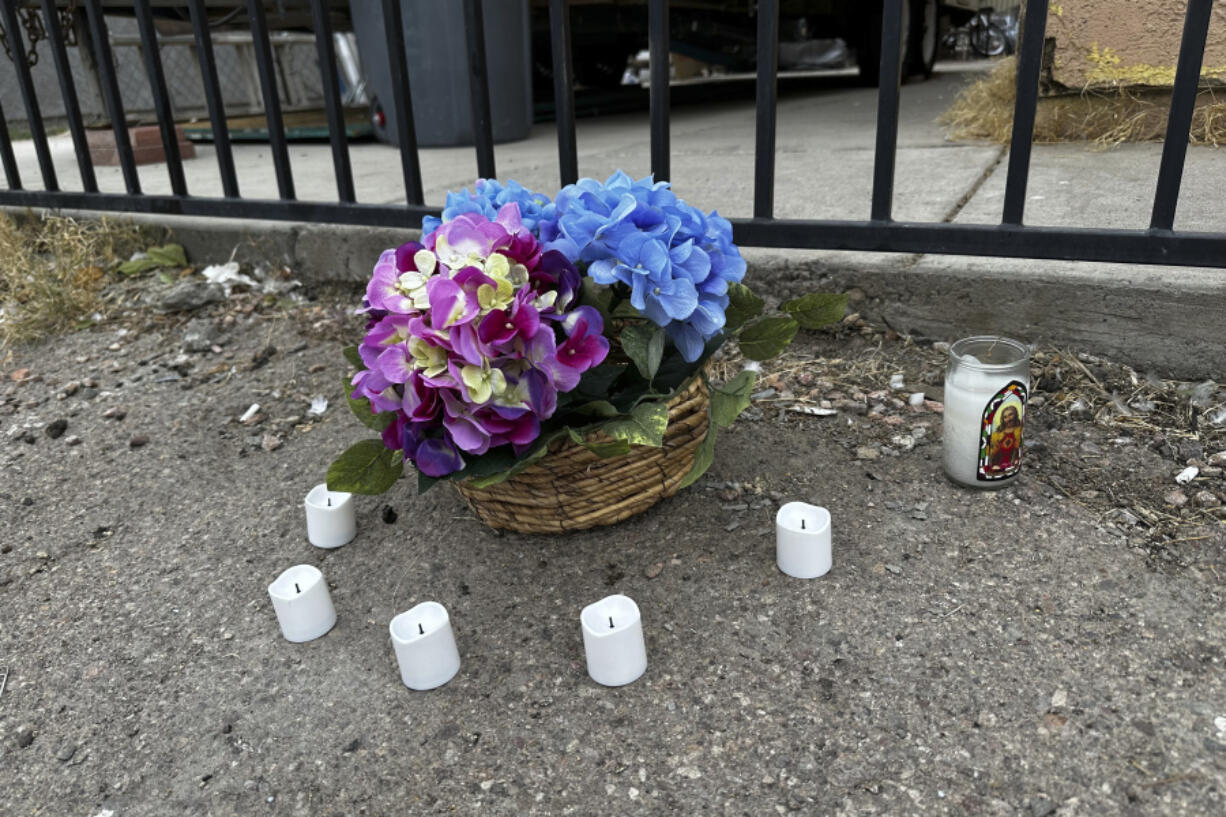 A small memorial is placed in an alleyway near Rancho High School in eastern Las Vegas on Wednesday, Nov. 15, 2023, the day after authorities announced the arrests of eight students on suspicion of murder in the beating of a classmate. Police said the fight happened two weeks earlier after classes ended for the day and left a 17-year-old boy dead.