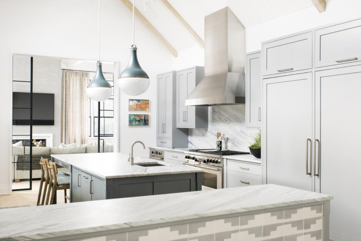 A kitchen by designer Cortney Bishop outside of New York that was inspired by the owner&rsquo;s visit to Sullivan Island in South Carolina. The distinctive patterned tile is from Exquisite Surface&rsquo;s Commune collection.
