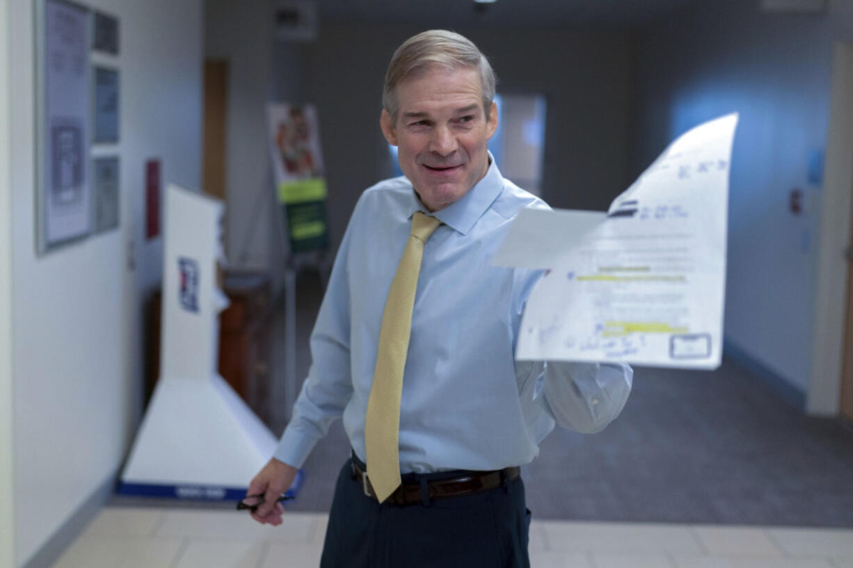 House Judiciary Committee Chair Jim Jordan, R-Ohio, holds an Justice Department email as he speaks with reporters after hearing from U.S. Attorney David Weiss in a transcribed interview before members of the House Judiciary Committee, Tuesday, Nov. 7, 2023, in Washington.