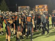 Washougal players gather with coaches on the field following the Panthers' 35-21 win over Aberdeen in the Class 2A district playoffs on Saturday, Nov. 4, 2023, at Washougal High School.