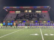 Columbia River and Steilacoom players gather on the field for introductions prior to their Class 2A girls soccer state playoff game on Wednesday, Nov. 8, 2023, at Columbia River High School.