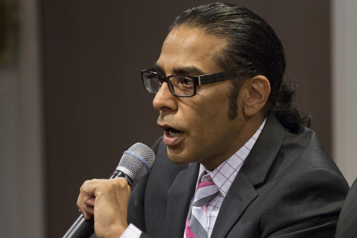 FILE - Gurpatwant Singh Pannun, left, speaks, Sept. 26, 2014 in New York. India has set up a high-level inquiry after U.S. authorities raised concerns with New Delhi that its government may have had knowledge of a plot to kill the Sikh separatist leader on American soil, an Indian official said on Wednesday, Nov. 29, 2023.