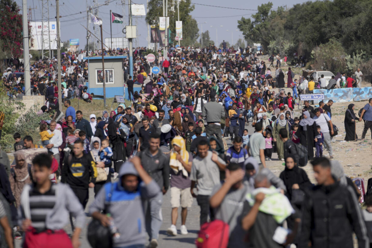 Palestinians flee to the southern Gaza Strip on Salah al-Din Street in Bureij, Gaza Strip, Thursday, Nov. 9, 2023.