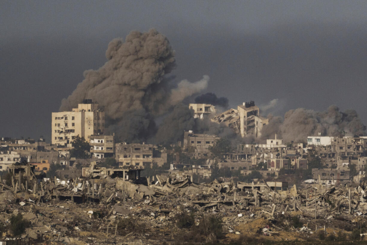 Smoke rises following an Israeli bombardment in the Gaza Strip, as seen from southern Israel, Thursday, Nov. 23, 2023.