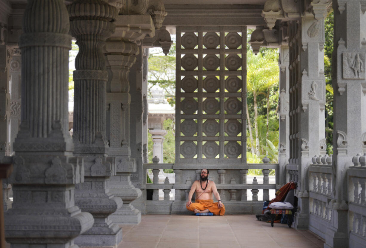 Sannyasin Siddhanathaswami sits in the Iraivan Temple at the Kauai Hindu Monastery on July 9 in Kapaa, Hawaii.