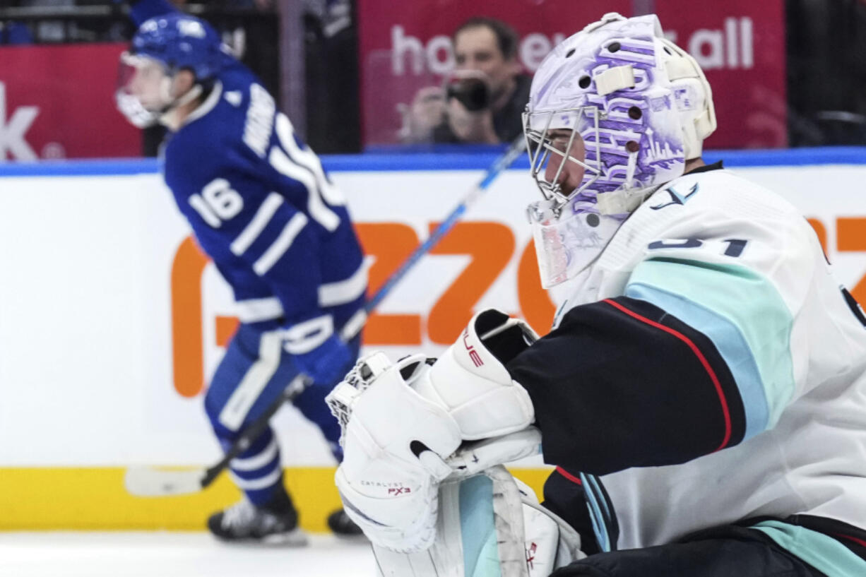 Seattle Kraken goaltender Philipp Grubauer pauses after Toronto Maple Leafs&rsquo; Mitchell Marner scored his third goal, during the second period of an NHL hockey game Thursday, Nov 30, 2023, in Toronto.