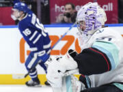 Seattle Kraken goaltender Philipp Grubauer pauses after Toronto Maple Leafs&rsquo; Mitchell Marner scored his third goal, during the second period of an NHL hockey game Thursday, Nov 30, 2023, in Toronto.
