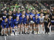 The La Center volleyball team poses with the third-place trophy at the Class 1A state volleyball tournament on Saturday, Nov, 11, 2023 in Yakima. The Wildcats beat Meridian in four sets to place third for the third time in program history and the first time since 1995.