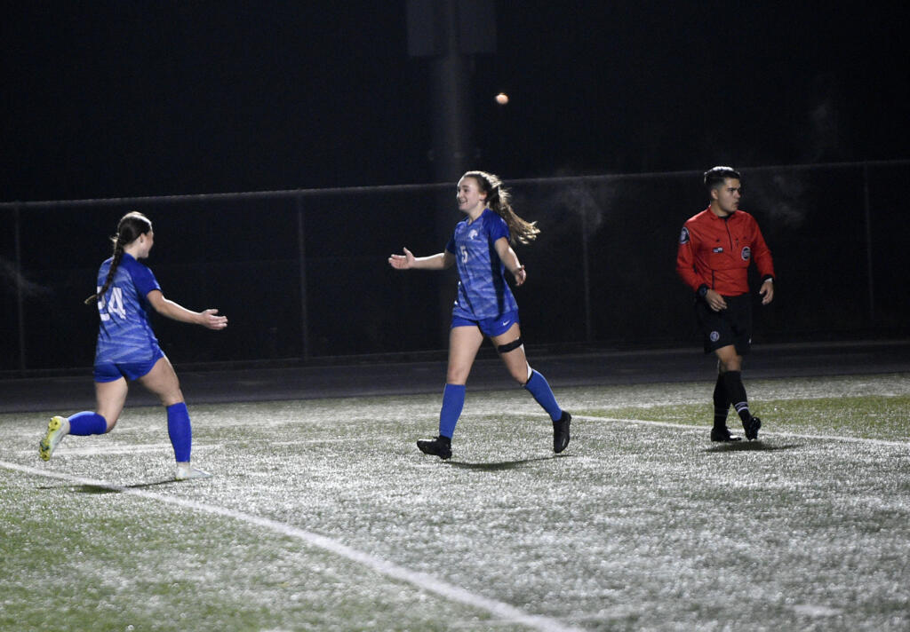 Shaela Bradley of La Center (right) celebrates her second goal of the match with Briley Vanderhoef (24) during the Wildcats’ 3-2 win over Meridian of Bellingham in a Class 1A girls soccer state tournament first-round match at Woodland High School on Wednesday, Nov. 8, 2023.