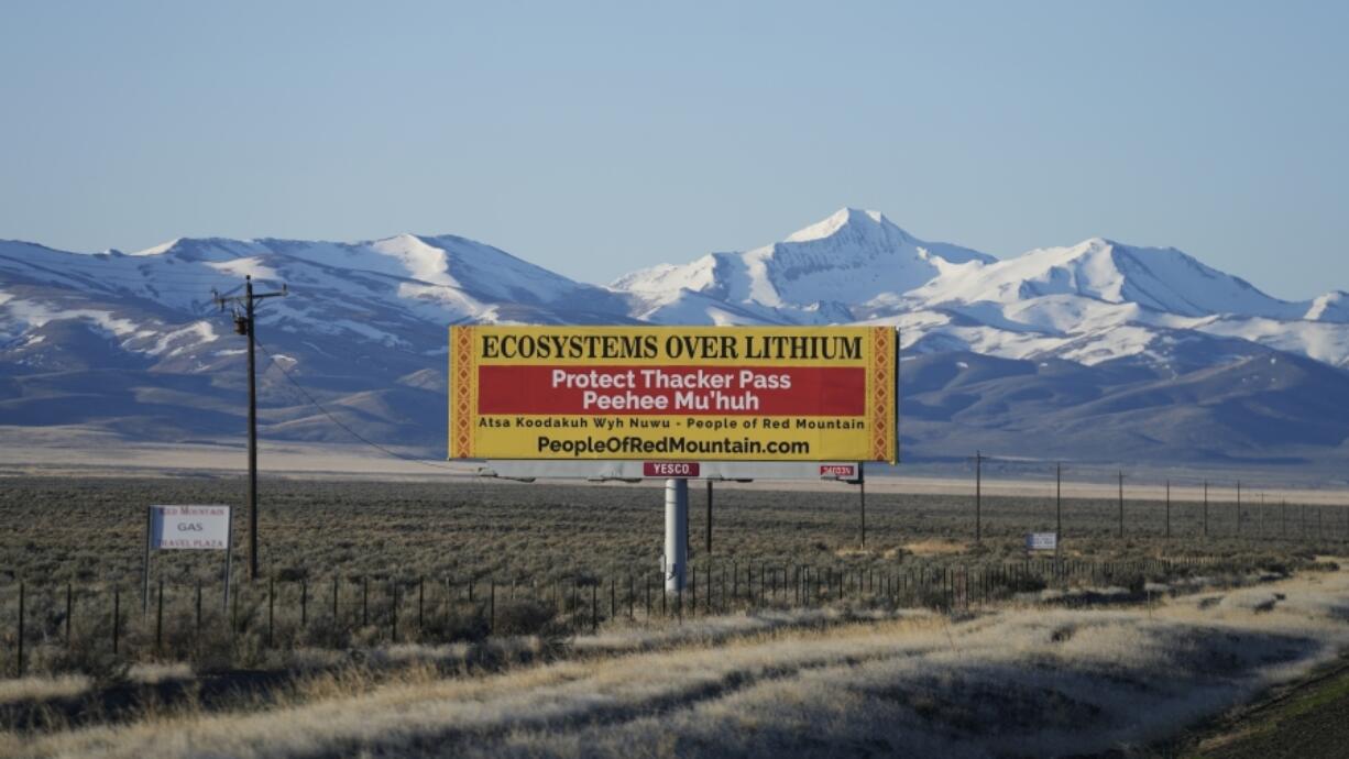 FILE - A billboard reads, &ldquo;Protect Thacker Pass,&rdquo; near the Fort McDermitt Paiute-Shoshone Indian Reservation, April 25, 2023, near McDermitt, Nev. A federal judge in Nevada has dealt another legal setback to tribes trying to halt construction of a huge lithium mine they say is near the sacred site of an 1865 massacre along the Oregon border.
