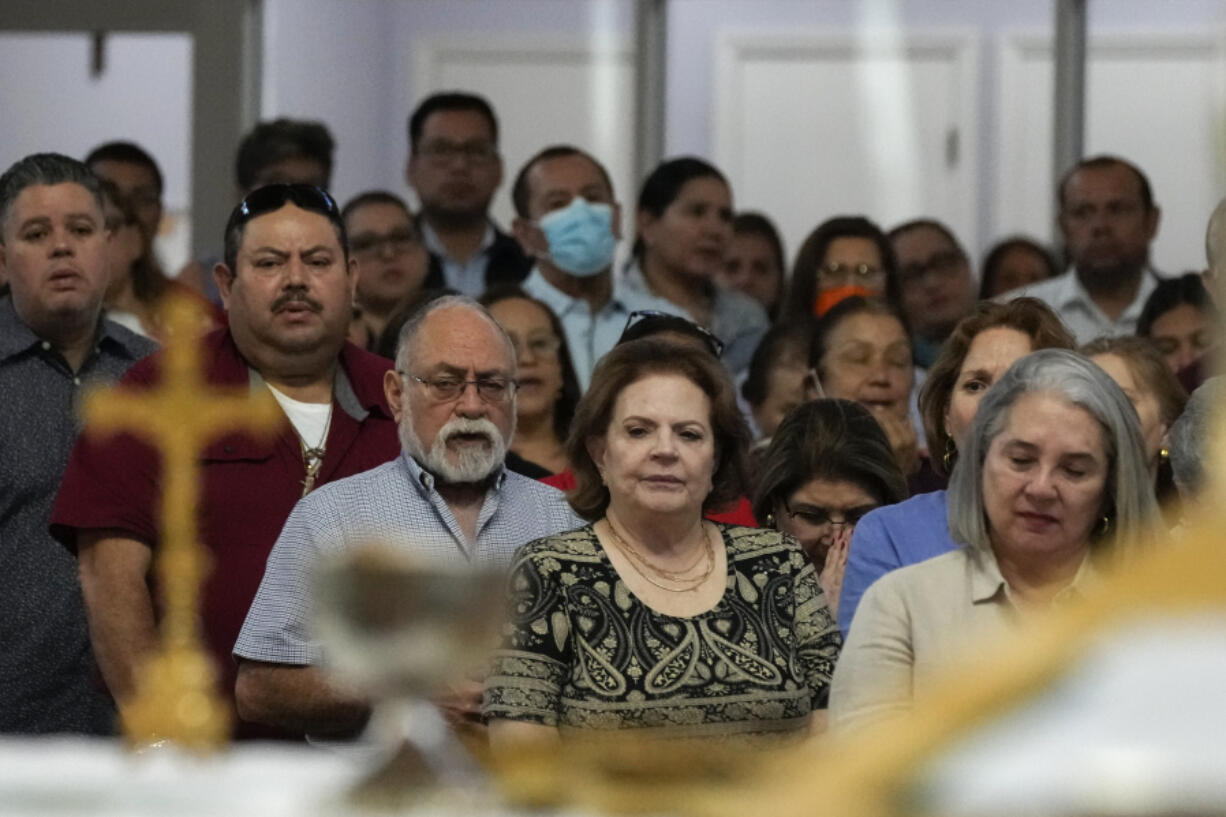 Parishioners attend Mass at St. Agatha catholic church, which has become the spiritual home of the growing Nicaraguan diaspora, Sunday, Nov. 5, 2023, in Miami. For the auxiliary bishop of Managua, one of his concelebrant priests and many in the pews who have had to flee or were exiled from Nicaragua recently, the Sunday afternoon Mass at the Miami parish is not only a way to find solace in community, but also to keep pushing back against the Ortega regime&rsquo;s violent suppression of all critics, including many Catholic leaders.