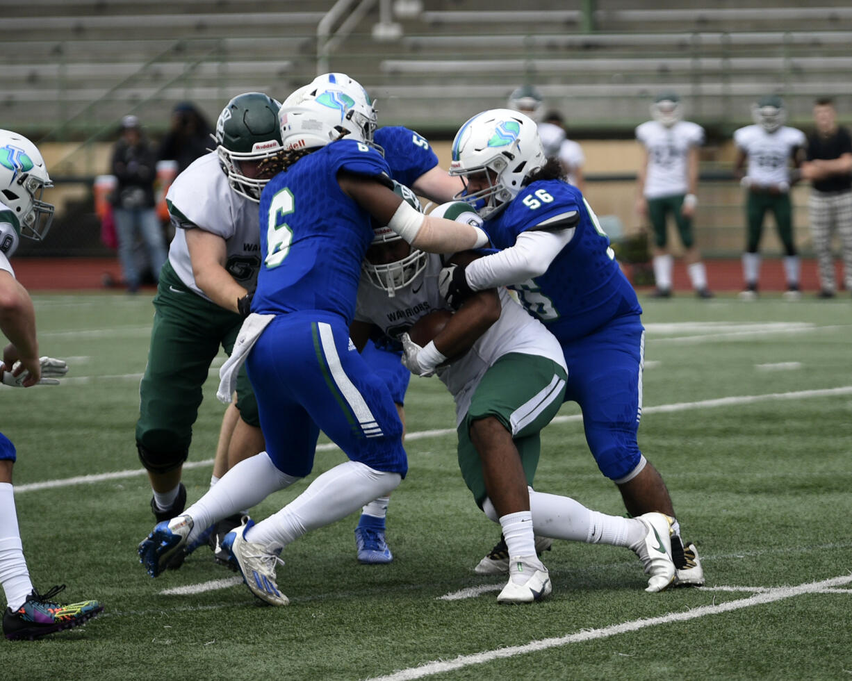 Mountain View's Jaden Brown (6) and Hector Hernandez (56) team up to tackle Rashaad Gerona-Chatters of Edmonds-Woodway during the Thunder's 42-28 win over Edmonds-Woodway in the 3A state preliminary round game at McKenzie Stadium on Saturday, Nov. 4, 2023.