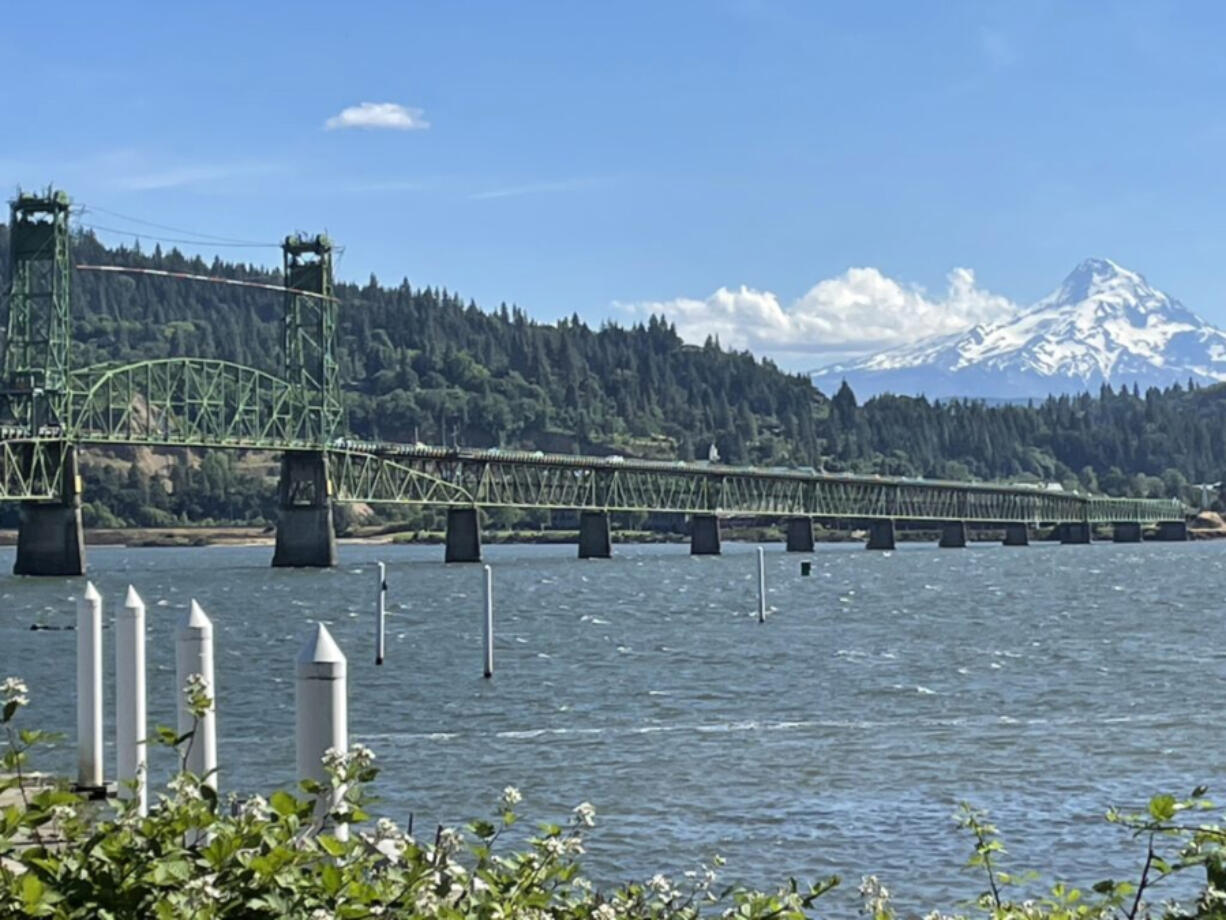 The Hood River-White Salmon Bridge spans the Columbia River, with Mount Hood towering behind it.