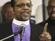 FILE - Bishop Carlton Pearson speaks at a news conference accompanied by several other clergy members, April 4, 2013, in Chicago. Bishop Carlton Pearson died Sunday, Nov. 19, 2023 in hospice care in Tulsa due to cancer according to his agent. He was 70. (AP Photo/M.