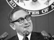 Secretary of State Henry Kissinger briefs reporters, Oct. 12, 1973, at the State Department in Washington. Kissinger, the diplomat with the thick glasses and gravelly voice who dominated foreign policy as the United States extricated itself from Vietnam and broke down barriers with China, died Wednesday. He was 100.