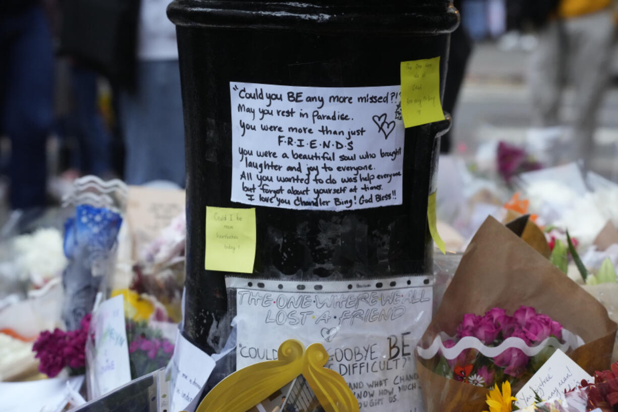 A makeshift memorial for Matthew Perry is seen outside the building shown in exterior shots of the television show "Friends" on Monday, Oct. 30, 2023, in New York. Perry, who played Chandler Bing on NBC's "Friends" for 10 seasons, was found dead at his Los Angeles home on Saturday. He was 54.