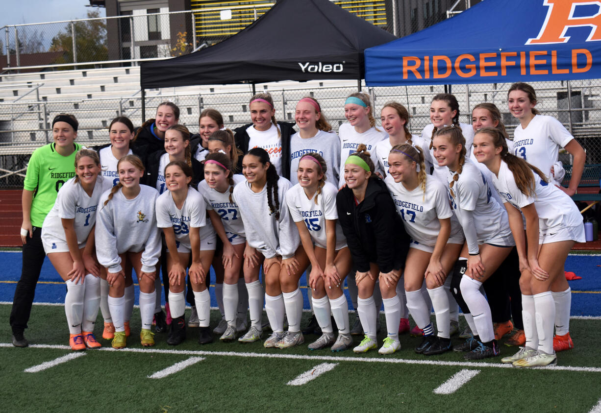 The Ridgefield girls soccer team poses for a team photo after a 2-1 win over Fife on penalty kicks in the Class 2A state quarterfinal match at Fife High School on Saturday, Nov. 11, 2023.
