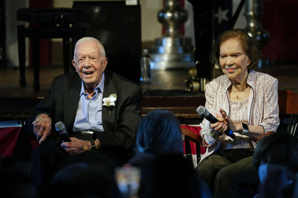 FILE - Former President Jimmy Carter and his wife former first lady Rosalynn Carter sit together during a reception to celebrate their 75th wedding anniversary Saturday, July 10, 2021, in Plains, Ga. Rosalynn Carter, the 96-year-old former first lady, is in hospice care at home, the Carter Center says.