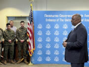 U.S. Secretary of Defense Lloyd Austin, right, speaks to employees of the U.S. embassy in Kyiv, Monday, Nov. 20, 2023, during his visit to Ukraine.  Austin has made an unannounced visit to Kyiv Monday, in what is expected to be a high-profile push to keep money and weapons flowing to Ukraine even as U.S. and international resources are stretched by the new global risks raised by the Israel-Hamas conflict.  (W.G.