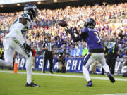 Baltimore Ravens wide receiver Odell Beckham Jr. (3) catches the ball for a touchdown during the second half of an NFL football game against the Seattle Seahawks, Sunday, Nov. 5, 2023, in Baltimore.