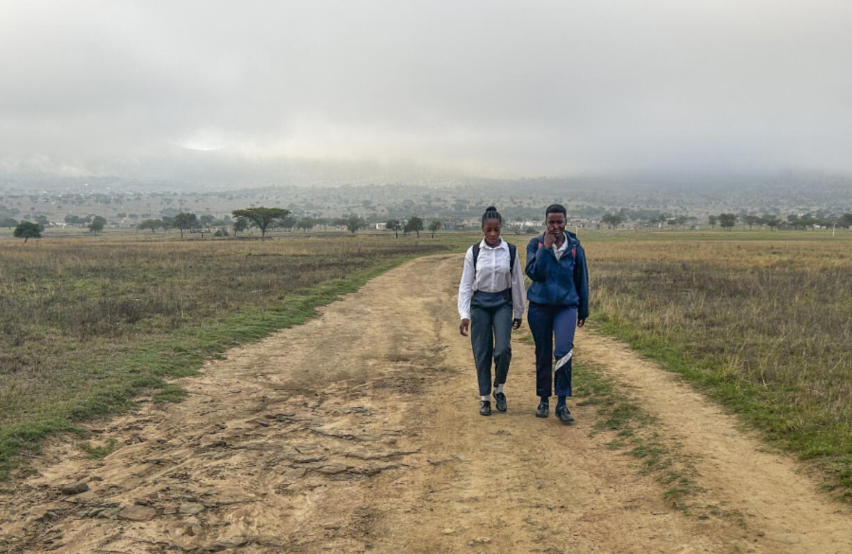 Luyanda Hlali, left, and her friend Mimi Dubazane embark Oct.