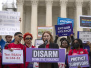 Actor Julianne Moore speaks during a rally at the Supreme Court on Tuesday, Nov. 7, 2023, in Washington. The Supreme Court is taking up a challenge to a federal law that prohibits people from having guns if they are under a court order to stay away from their spouse, partner or other family members.