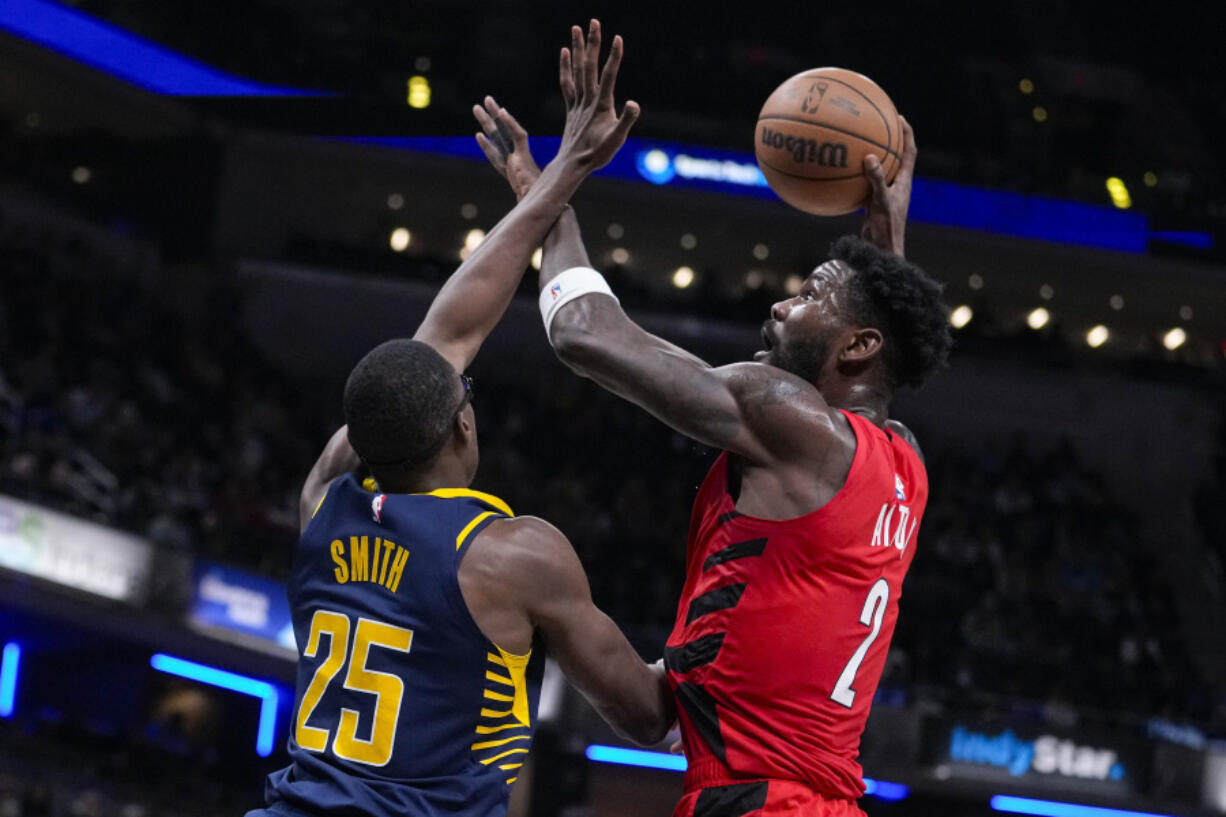 Portland Trail Blazers center Deandre Ayton (2) shoots over Indiana Pacers forward Jalen Smith (25) during the first half of an NBA basketball game in Indianapolis, Monday, Nov. 27, 2023.