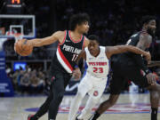 Portland Trail Blazers guard Shaedon Sharpe (17) drives on Detroit Pistons guard Jaden Ivey (23) in the first half of an NBA basketball game in Detroit, Wednesday, Nov. 1, 2023.