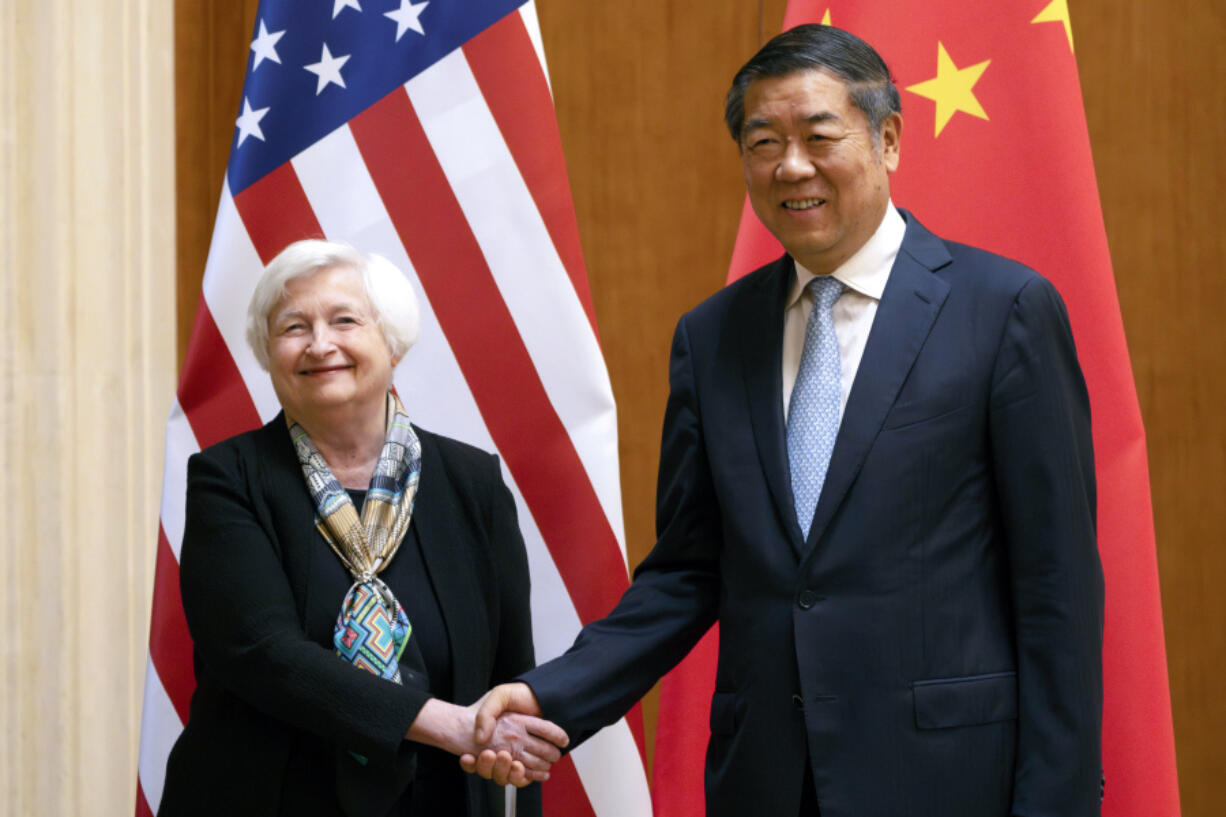 FILE - Treasury Secretary Janet Yellen, left, shakes hands with Chinese Vice Premier He Lifeng during a meeting at the Diaoyutai State Guesthouse in Beijing, China, July 8, 2023. Yellen is hosting He for two days of talks this week. The meeting is set for Thursday, Nov. 9, and Friday, Nov. 10, in San Francisco ahead of the Asia-Pacific Economic Cooperation summit and is the latest in a series of high-level talks between U.S. and Chinese officials aimed at easing tensions between the two economic powers.