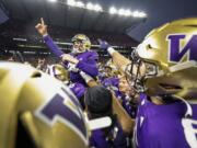 Washington&rsquo;s Grady Gross is carried off the field after kicking the winning field goal against Washington State during an NCAA college football game Saturday, Nov. 25, 2023, in Seattle.