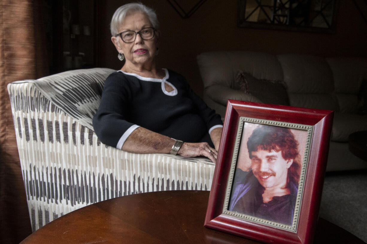 Sharol Lucey, a 76-year-old Vancouver resident, is among the longest-living heart transplant patients in the region. She sits near a picture of her heart donor, Steven Haugen, who died in 1997, making her life possible.