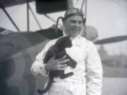 Barnstorming pilot Tex Rankin with Alba Barba, a black cat loaned to him as a &ldquo;jinx&rdquo; for a cross-country air race from New York to Los Angeles. Rankin&rsquo;s plane also bore the number 13.