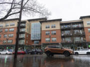 Rain falls over the Esther Short Commons apartment building in Vancouver. The building will receive a new roof, flooring and more.