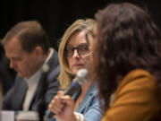 Sen. Annette Cleveland, D-Vancouver, center, listens as Rep. Monica Stonier, D-Vancouver, right, speaks to the crowd during the 2024 Legislature Outlook at the Hilton Vancouver Washington on Friday morning.