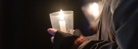 Attendees hold candles Friday, Dec. 21, 2023, during a Homeless Persons Memorial Day event at St. Paul Lutheran Church in downtown Vancouver.