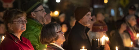 Attendees hold candles Friday, Dec. 21, 2023, during a Homeless Persons Memorial Day event at St. Paul Lutheran Church in downtown Vancouver.