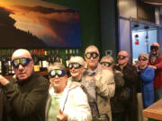 Diners in black-out glasses head into the Black Forest Dark Dining Experience at Wyld Pines in east Vancouver.