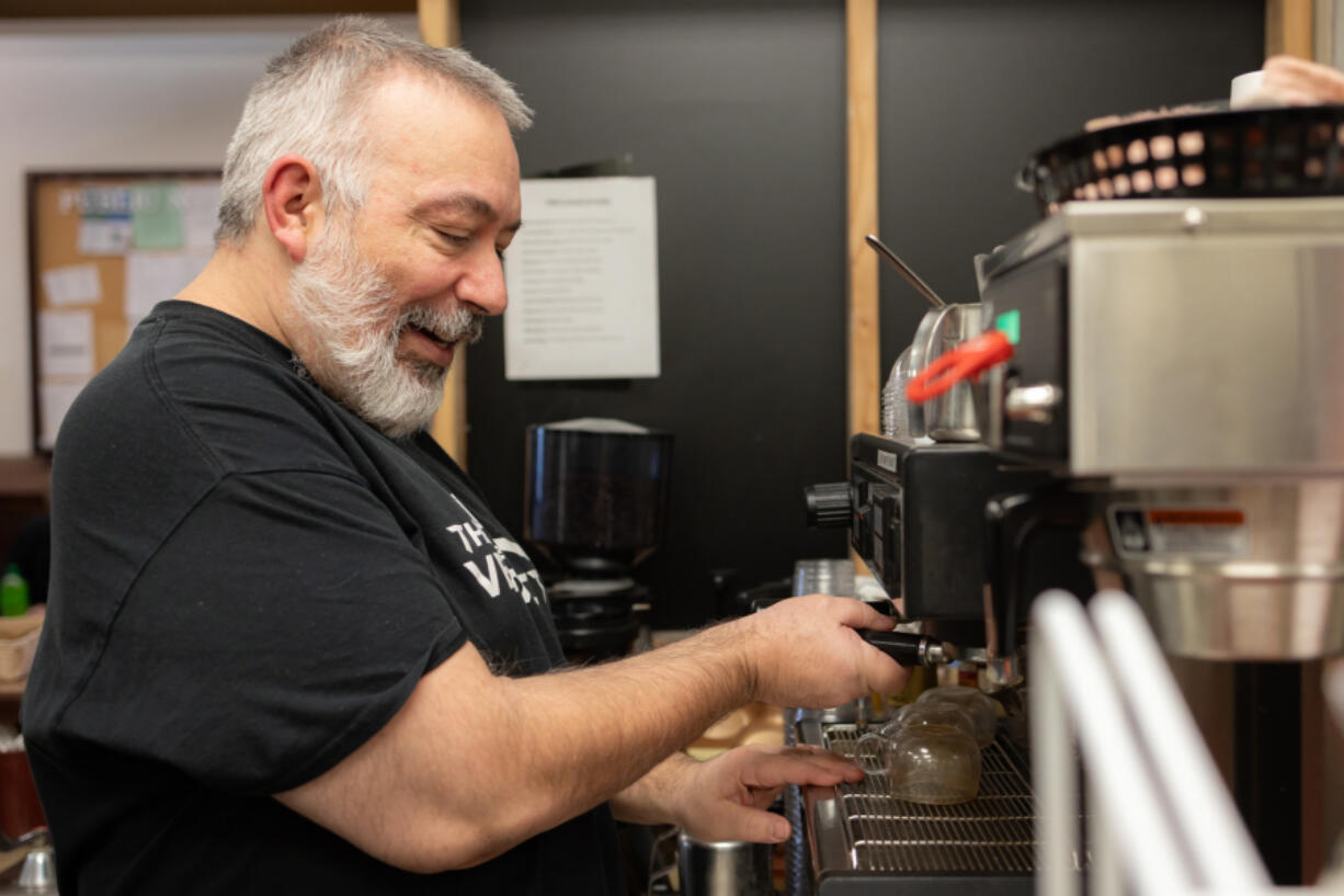 Billy Albertson begins to prepare a latte while working at The Verdict, the deli and cafe at the Clark County Courthouse in downtown Vancouver. Albertson is visually impaired and explained the techniques he&rsquo;s used to operate the cafe for nearly seven years.