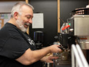 Billy Albertson begins to prepare a latte while working at The Verdict, the deli and cafe at the Clark County Courthouse in downtown Vancouver. Albertson is visually impaired and explained the techniques he&rsquo;s used to operate the cafe for nearly seven years.