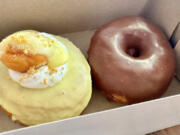 Lemon meringue doughnut and chocolate covered doughnut from Nextdough Neighbor.