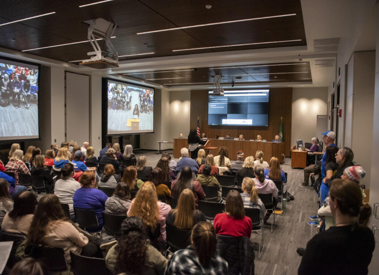 People fill the meeting room at Evergreen Public Schools headquarters March 14. The district is early in its budget preparation process for 2024 but is already predicting it will face a deficit for the third straight year.