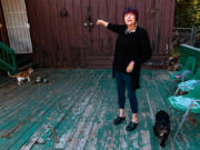 Megan Vasquez stands on her damaged deck in Crestline. She started a food distribution center in her neighborhood after Goodwin&Ccedil;&fnof;&Ugrave;s market collapsed.