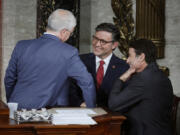 U.S. Speaker Pro Tempore Rep. Patrick McHenry (R-NC) (left), Rep. Mike Johnson (R-LA) (center) and Rep. Garret Graves (R-IA) talk as the House of Representatives holds an election for a new Speaker of the House at the U.S. Capitol on Oct. 25, 2023, in Washington, DC.