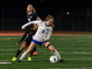 La Center senior midfielder Shaela Bradley shields off Klahowya junior Amira Lyons in a 1A State girls soccer semifinal game on Friday, Nov. 17, 2023, at Mount Tahoma Stadium in Tacoma.